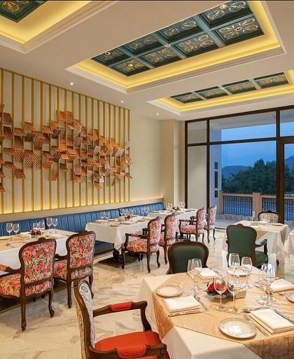 For this restaurant at the IHCL in Haridwar, I blended regal aesthetics with modern sophistication. The space features a dramatic 3D wall art installation, custom floral upholstery, and an intricately designed coffered ceiling.