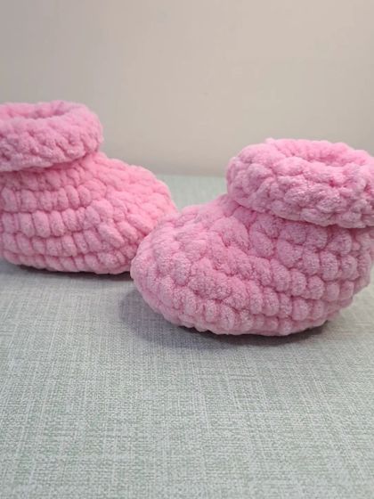 These soft, slipper-like booties are perfect for keeping a baby's feet warm and comfortable around the house.