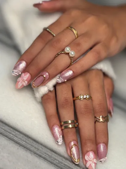 Both hands together, showing the full effect of this mixed-media nail art. The balance of glitter, 3D florals, and gold makes for a stunning and intricate set.
