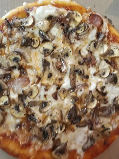 My popular gluten-free pizza topped generously with caramelized onions and mushrooms over a layer of homemade vegan cheese. It's a classic flavour combination that everyone loves.