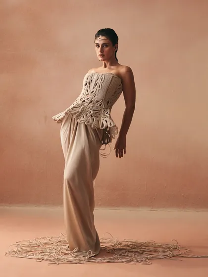 The Karov silhouette in motion, where the knotted cords of the sculpted corset are balanced by the fluid satin drape skirt, embodying the essence of my 'Cord Memory' collection.