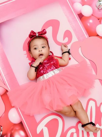 A real-life Barbie doll! This overhead shot captures the fun and glamour of our all-pink Barbie-themed setup, complete with a life-sized doll box.