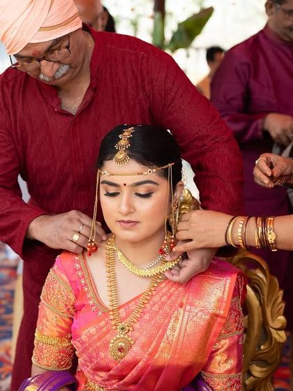 A special moment as the groom ties the thaali. I feel honored to be a part of these significant traditions and to help the bride look her absolute best.