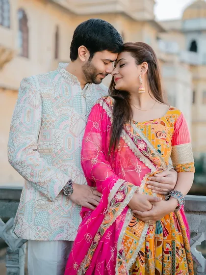 A close-up portrait highlighting the couple's connection and the intricate details of their traditional pre-wedding attire.