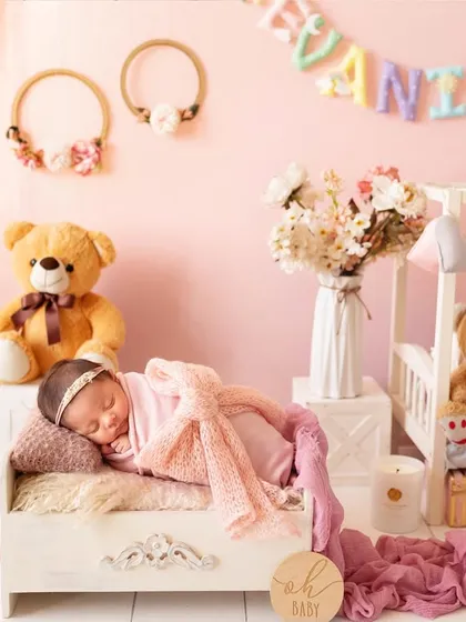A wider view of a beautiful pink-themed newborn setup, complete with a personalized name banner. These elaborate sets are part of my luxury newborn sessions.