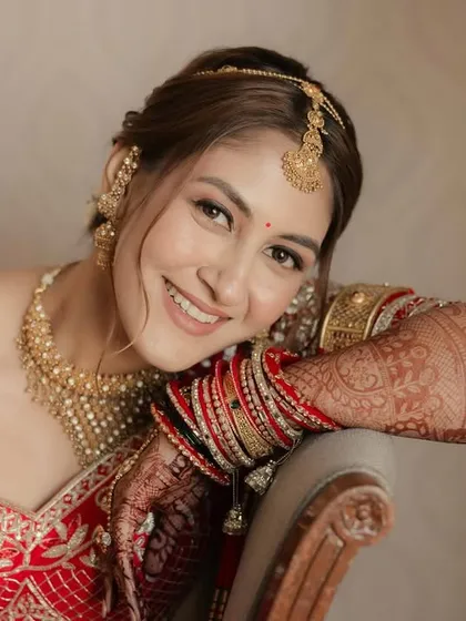 The pure joy of a bride on her wedding day. The soft glam makeup ensures she looks radiant and feels comfortable throughout the long ceremony.