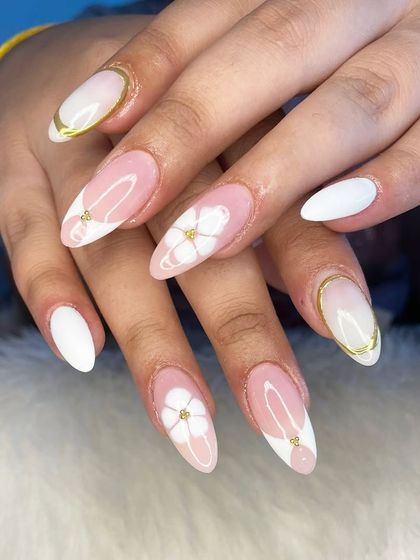 An elegant white and pink set with 3D flowers and gold chrome details.