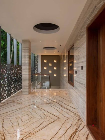 A view from inside looking out, framing the landscape like a living painting. This image highlights how we use architectural elements to enhance the connection between the interior space and the natural beauty of the Nandi Hills.