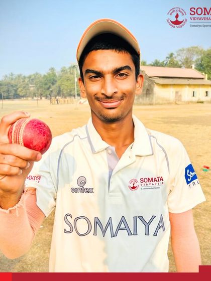 Bhavik Lone, who delivered a match-winning bowling spell, holds the cricket ball he used to take 4 wickets for 20 runs.