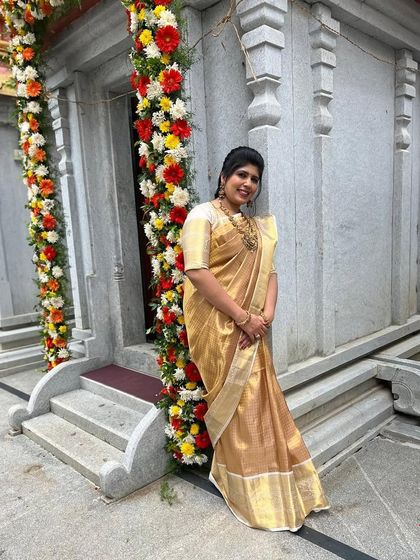 Our client Shilpa in another beautiful designer silk saree, this one a classic all-gold piece.