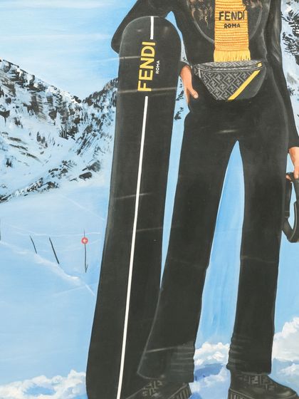 A closer look at Mona Lisa's Fendi-branded snowboard and ski attire, blending high fashion with high art.