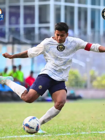 A powerful shot from our captain, demonstrating leadership and a will to drive the team forward.