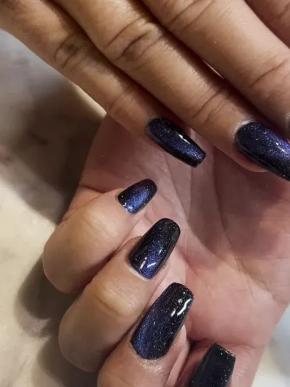 The way the light hits this dark blue cat-eye polish creates a beautiful, bright shimmer against the deep base color.