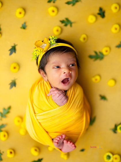 A little ray of sunshine giving a big yawn. This bright yellow setup is so cheerful and perfect for capturing your baby's cutest expressions.