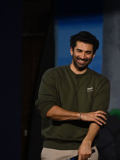 A candid shot of Aditya Roy Kapur. I styled him in this simple olive green sweatshirt for a relaxed, approachable look that’s perfect for a casual public appearance. No poses, just good vibes.