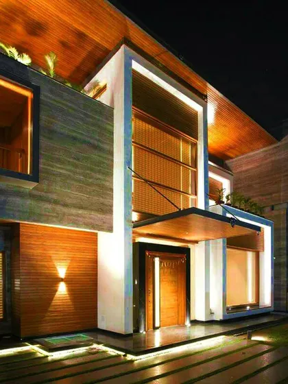 For the "Kohinoor" residence, I employed warm, layered lighting to accentuate the natural textures of stone and wood. The design creates a welcoming yet dramatic entrance, using concealed linear lights and subtle uplighting.