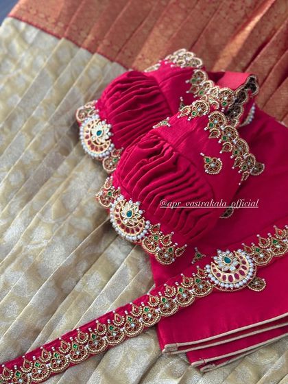 A detailed shot of the ruched puff sleeves, finished with an embroidered cuff that mimics a traditional arm cuff or 'vanki'.