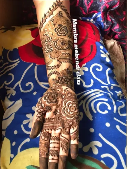 A full hand design that combines traditional Indian motifs with modern floral patterns. Versatility is key!
