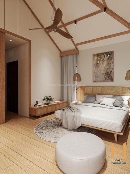 A Japandi-style bedroom with a vaulted ceiling and exposed wooden beams, creating a spacious and airy feel.