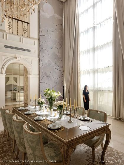 A formal dining setting in The Ivory Royale, positioned by a towering window with flowing drapes. The space feels both grand and intimate, perfect for elegant dinners where conversations can linger long into the evening.