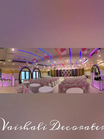 Another wide-angle shot of a banquet hall, showing the complete layout with decorated seating arrangements and ambient lighting, ensuring a consistent look and feel throughout the space.