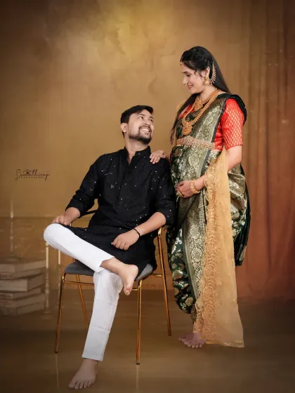 A beautiful moment between a couple in traditional attire. The rich texture of the Paithani saree and the classic kurta create a look that is both culturally rich and deeply personal.