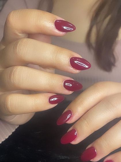 Wine o'clock! A beautiful, deep wine-red polish on almond-shaped nails.
