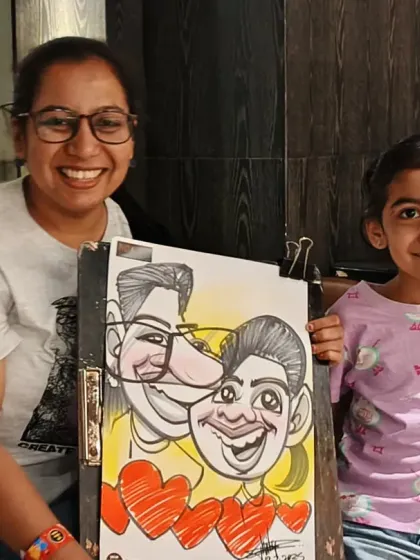 A mother and daughter with their couple caricature. It's a lovely way to capture the bond between family members at any event.