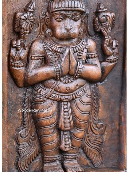 Another close-up of the Hanuman Kavadi, focusing on the texture and finish of the wood.