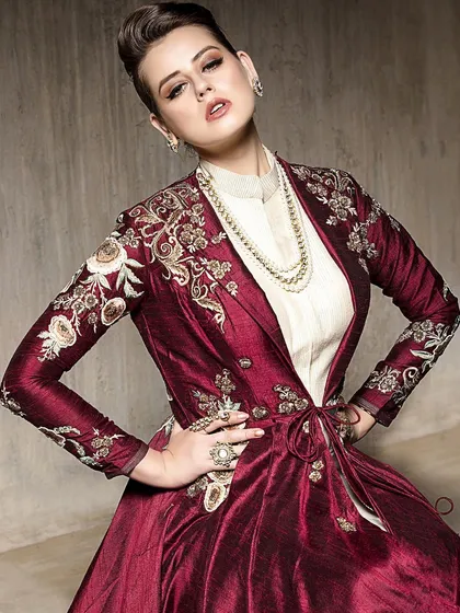 I work with models to strike strong, confident poses that showcase the attitude of the clothing. Here, the power pose complements the structured, embroidered maroon jacket, creating a memorable fashion portrait.