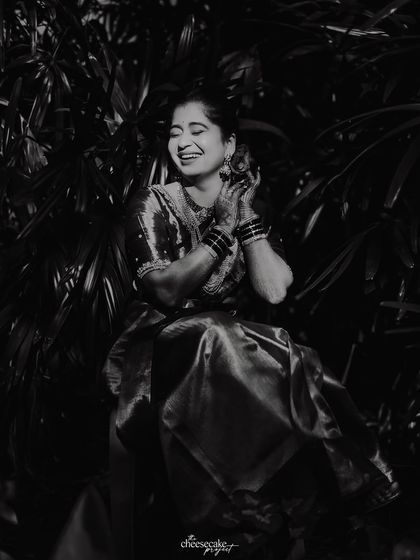 A joyful black and white portrait of the bride, her laugh is infectious.