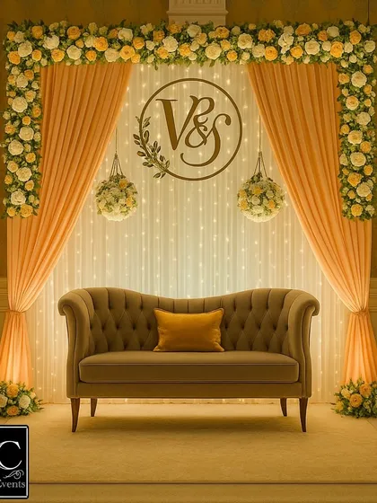 An engagement marks a beautiful new chapter. I designed this elegant backdrop with soft peach drapes, a custom 'V&S' monogram, and warm fairy lights to create a romantic and personal atmosphere for the ring ceremony.