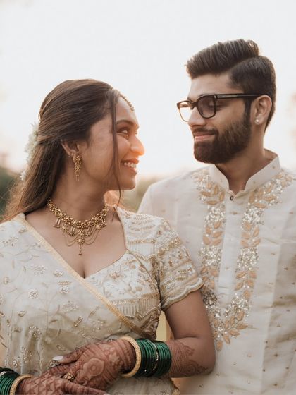 A golden hour portrait of the couple, the warm sunlight creating a beautiful glow around them.
