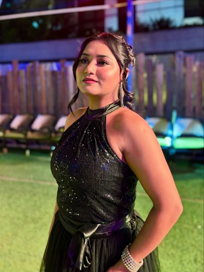 A side profile in my black evening gown. The shimmer from the sequins catches the light beautifully, making it perfect for an evening event with stage lighting.