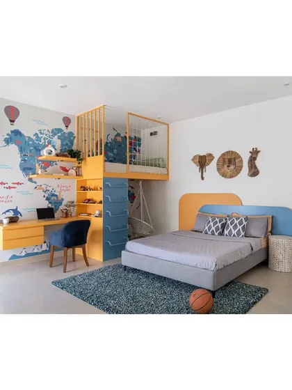 A vibrant and playful children's bedroom designed for learning and fun. The room features a custom world-map wallpaper, a bunk bed with a safety net and swing, and an integrated study area, creating a personal playground for a child to thrive in.