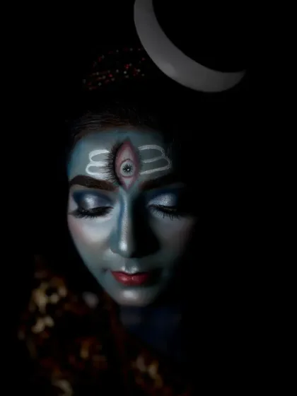 Another contemplative pose, this shot captures the dimensionality of the makeup under soft lighting, showing the careful blending and shading work.