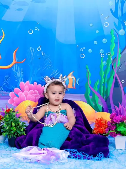 A full view of the mermaid-themed setup, showing the treasure chest, pearls, and vibrant coral.