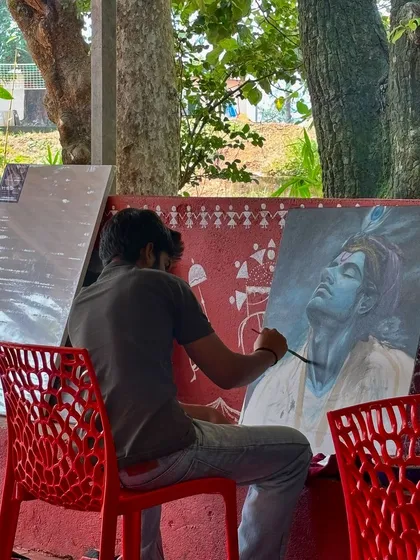 Here I am working on a large acrylic portrait of Krishna in a moment of divine contemplation. Painting deities is a form of meditation for me, a way to connect more deeply with my faith and create devotional art for your space.
