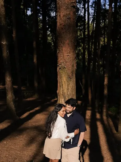 Lost in the woods, found in each other's arms. The dramatic play of light and shadow through the tall pines creates a beautifully intimate and moody atmosphere for this pre-wedding destination shoot.