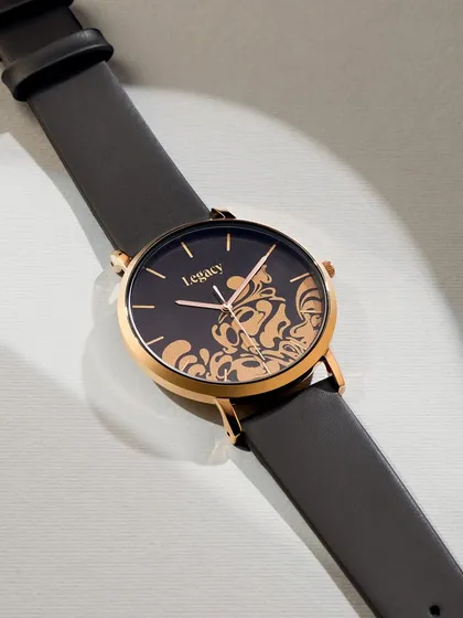 A simple, elegant shot of a Legacy watch from Jaipur Watch Company. The focus here is on the beautiful filigree design on the dial, set against a clean, bright background to make the gold pattern the star.