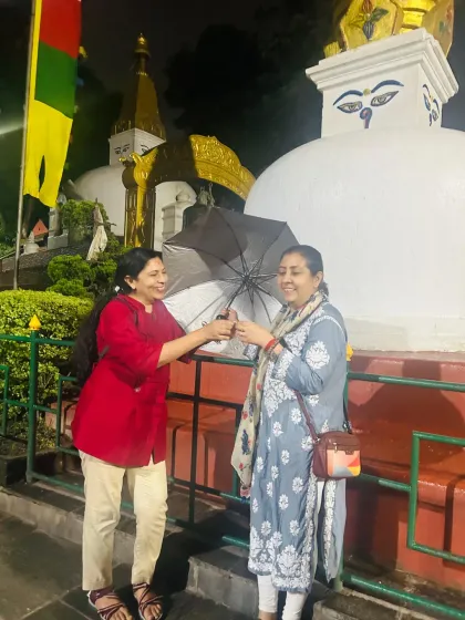 A candid moment of friendship and joy at the sacred site. Spiritual journeys are also about connection and lightheartedness.