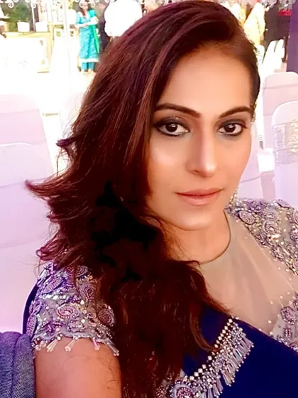 A stunning sangeet night look with dramatic, kohl-rimmed eyes and flawless skin.