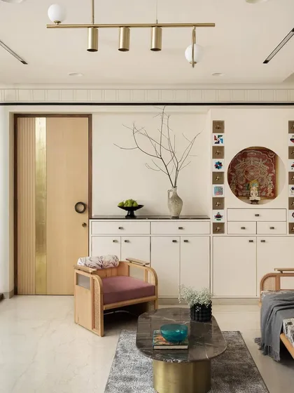 The formal living area features a custom-designed sofa, lounge chair, and center table from my 'Objects by Soch' collection. The space also incorporates a Jain mandir, respecting the client's beliefs with beautiful, integrated design.