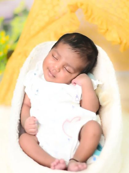A serene newborn portrait in a cozy, nest-like prop with a soft, bright background. My focus is on creating a peaceful setting for these gentle shots.