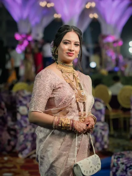 A beautiful candid shot of a bride at her reception, looking happy and relaxed.