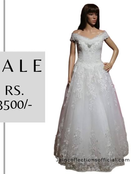 A classic white off-shoulder gown, perfect for a pre-wedding shoot or cocktail party, on sale for Rs. 3500.
