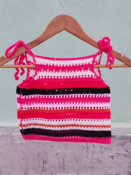 Another view of the custom striped halter top, hanging to show its full design.