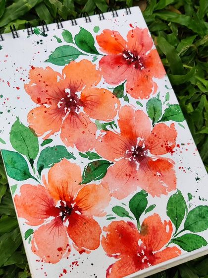 Another shot of the Speak Now-inspired floral painting, set against a background of green grass.