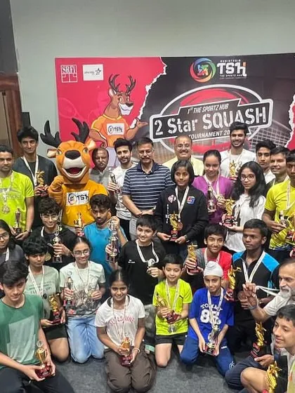 A group photo with all the winners and organizers at the TSH Star Squash Tournament.
