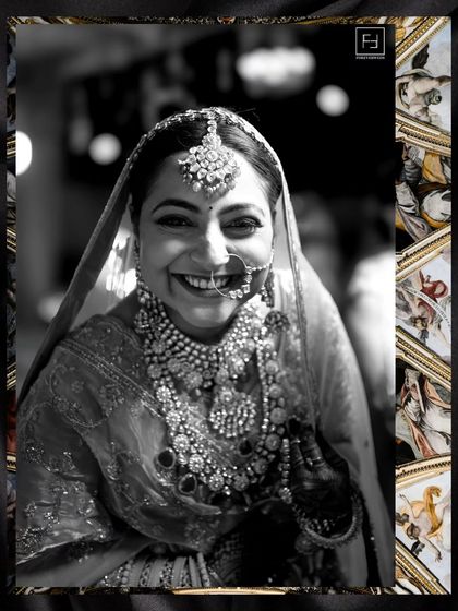 The smile of a bride who is truly happy. This black and white close-up of Prachi is radiant, capturing her infectious joy and the stunning detail of her Rajasthani bridal jewelry.